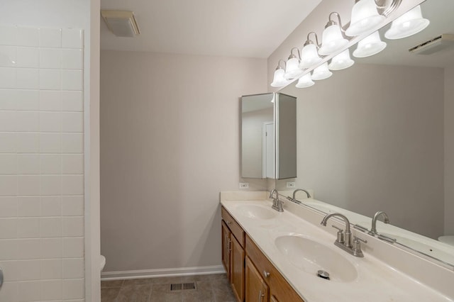 bathroom with tile patterned floors, vanity, and toilet