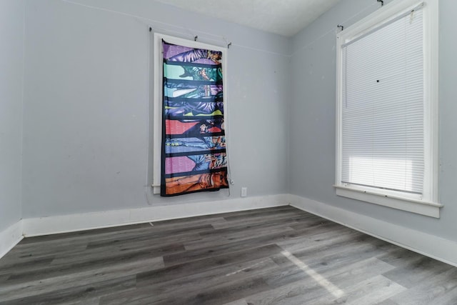 empty room with dark wood-type flooring