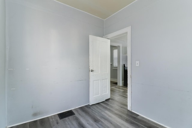 unfurnished room featuring wood-type flooring