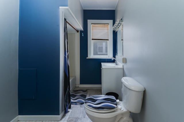 full bathroom featuring tile patterned flooring, vanity, toilet, and shower / tub combo with curtain