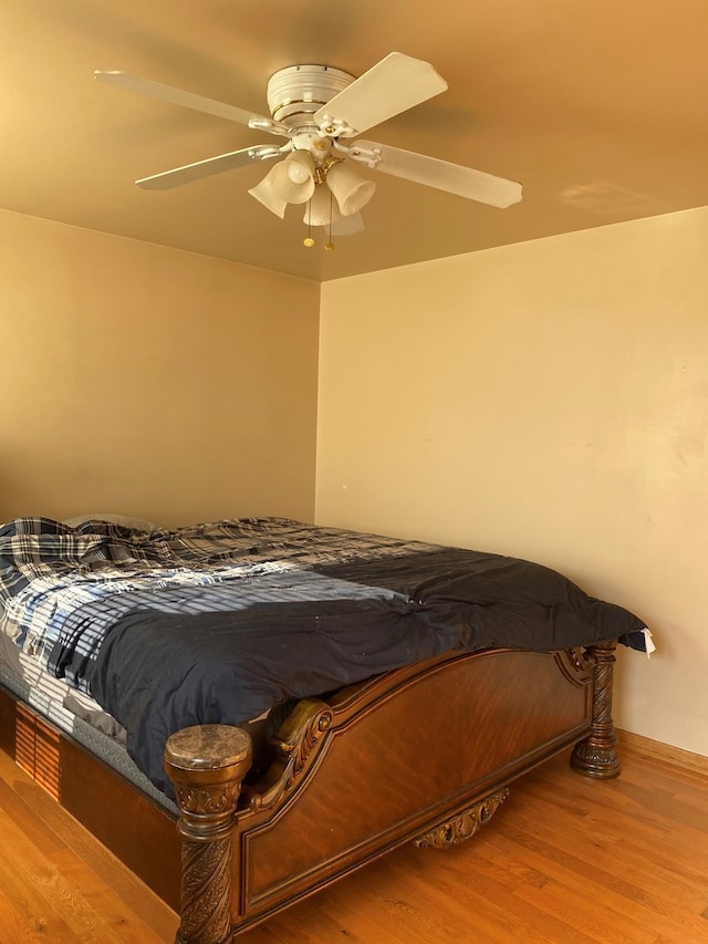 unfurnished bedroom with wood-type flooring and ceiling fan