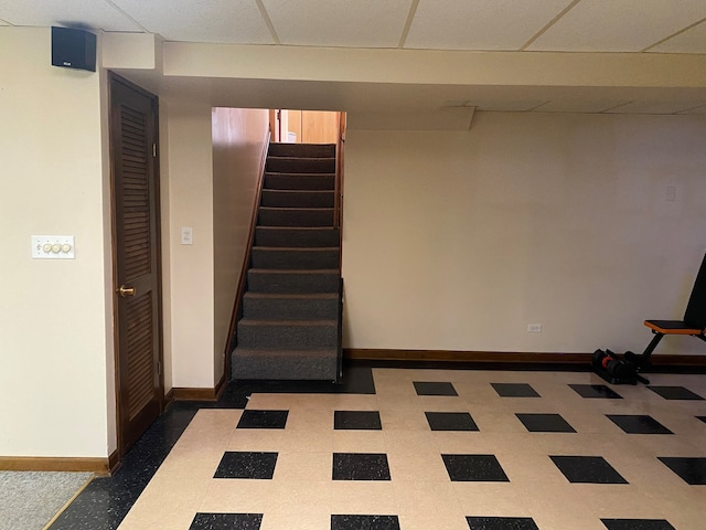 basement featuring a drop ceiling