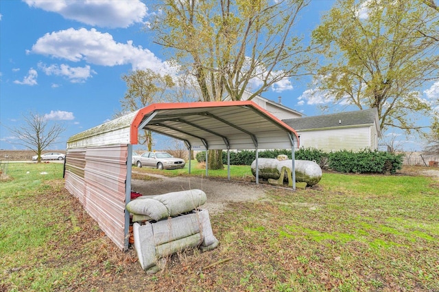 view of parking / parking lot with a yard and a carport