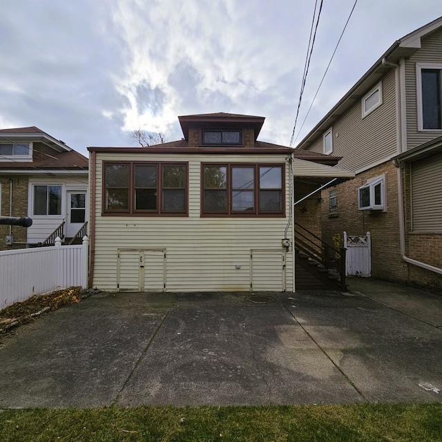 back of property with a patio area