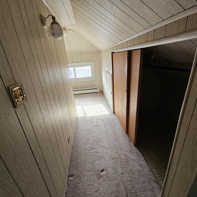 hall with light colored carpet, wooden walls, a baseboard radiator, wooden ceiling, and lofted ceiling