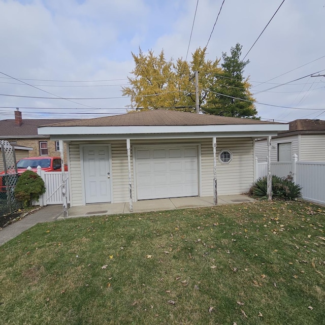 garage with a yard