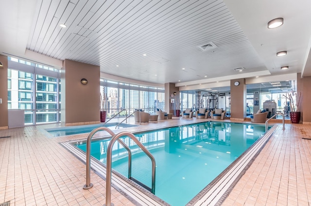 view of swimming pool with a jacuzzi