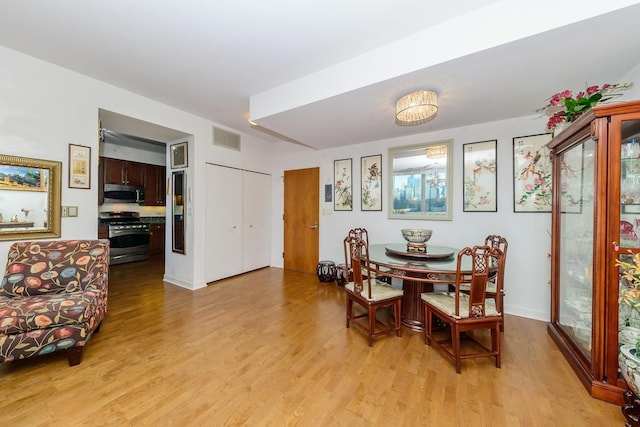 dining room with light hardwood / wood-style floors