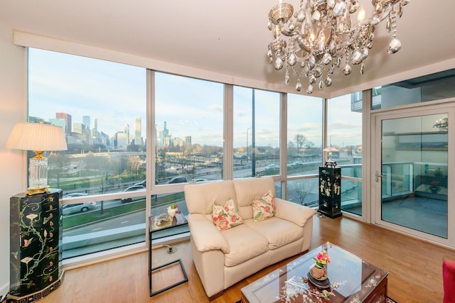 sunroom with a wealth of natural light and a notable chandelier