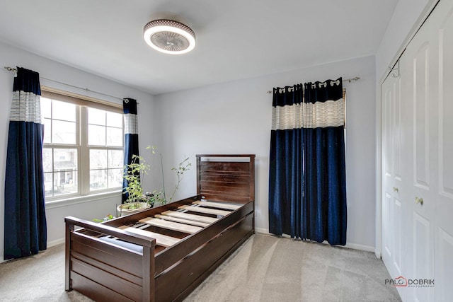 carpeted bedroom featuring a closet