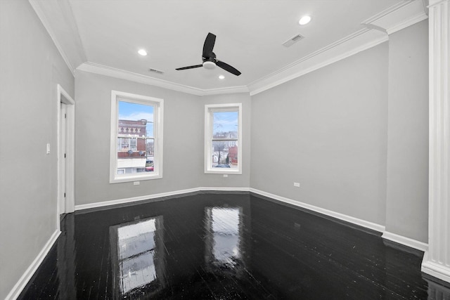 empty room featuring ceiling fan, dark hardwood / wood-style flooring, and ornamental molding