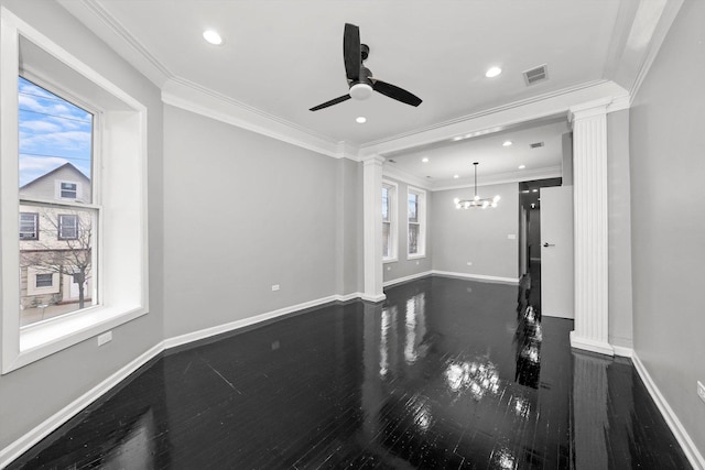 living room with ceiling fan with notable chandelier, ornate columns, crown molding, and dark wood-type flooring