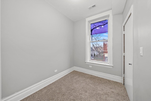 spare room featuring carpet floors