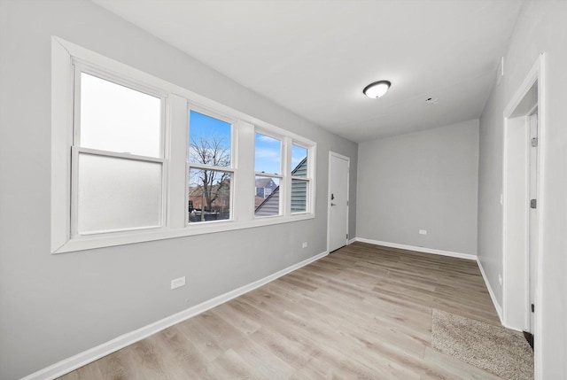 unfurnished bedroom featuring light wood-type flooring