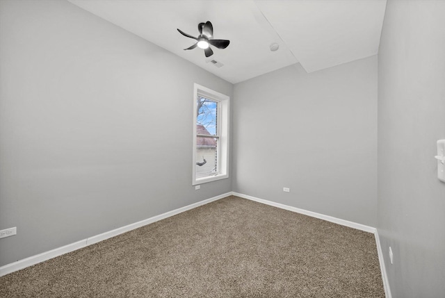 unfurnished room with ceiling fan and carpet floors