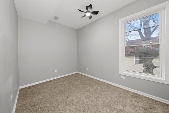 unfurnished room with ceiling fan and carpet floors