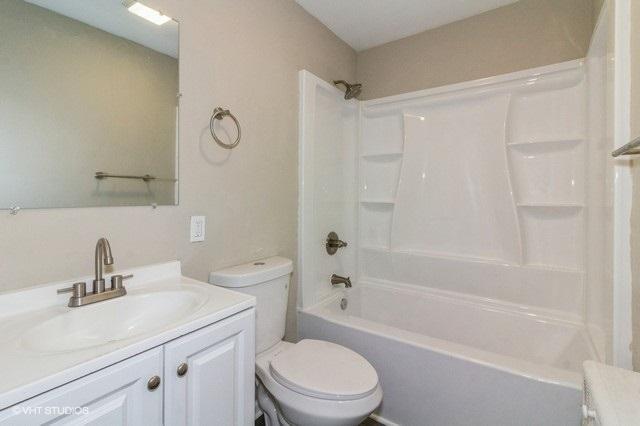 full bathroom with vanity, toilet, and shower / bath combination