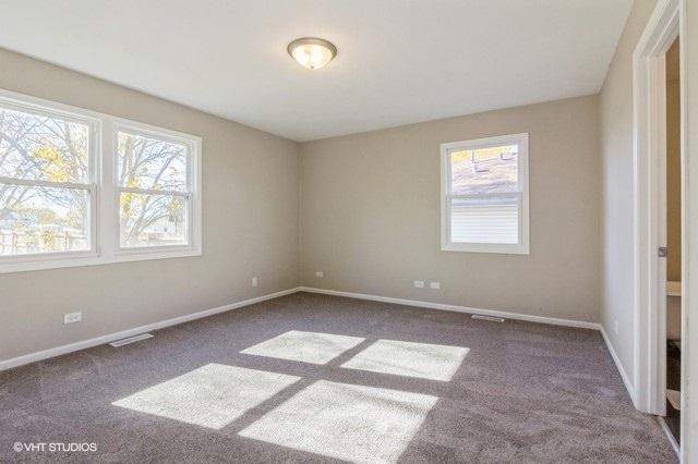 empty room featuring dark carpet