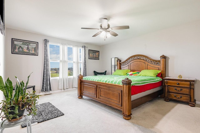 bedroom with light colored carpet and ceiling fan