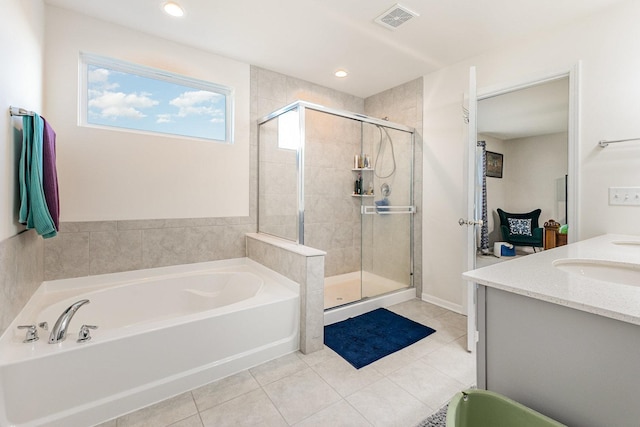 bathroom with a stall shower, tile patterned flooring, visible vents, a bath, and a sink