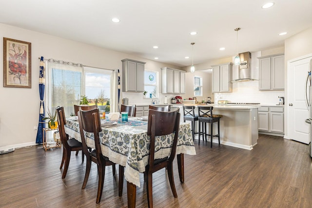 dining area with recessed lighting and dark wood-style floors