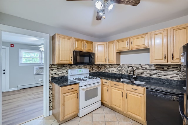 kitchen with light brown cabinetry, sink, dark stone countertops, and black appliances