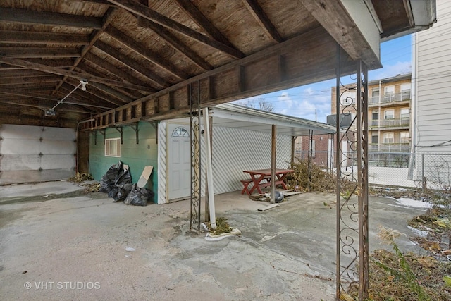 interior space with lofted ceiling and concrete floors