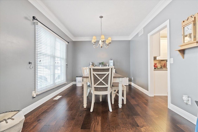 dining room with a notable chandelier, dark hardwood / wood-style flooring, and crown molding