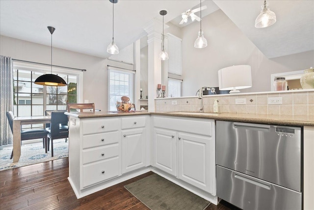 kitchen with dark hardwood / wood-style flooring, white cabinetry, dishwasher, and sink