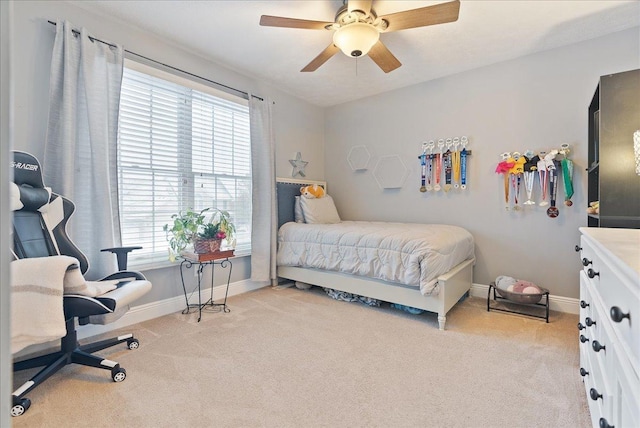 bedroom with ceiling fan and light colored carpet