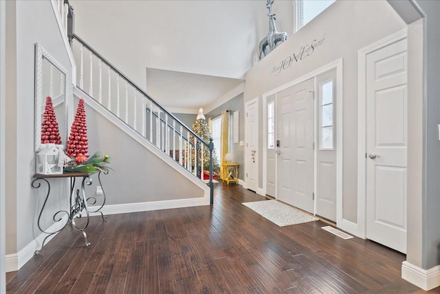 foyer with hardwood / wood-style floors and ornamental molding