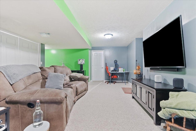 carpeted living room with a textured ceiling