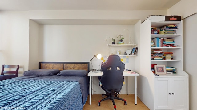 bedroom with hardwood / wood-style floors