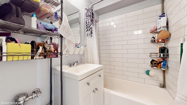 bathroom featuring vanity and shower / bath combo with shower curtain