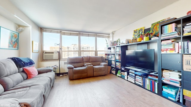 living room featuring light hardwood / wood-style floors and cooling unit