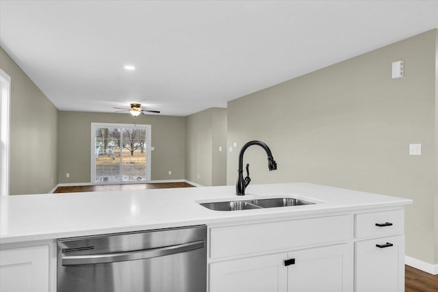 kitchen featuring sink, stainless steel dishwasher, white cabinets, and ceiling fan