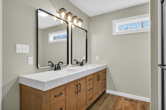 bathroom featuring vanity and wood-type flooring