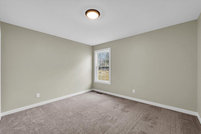 empty room featuring carpet flooring