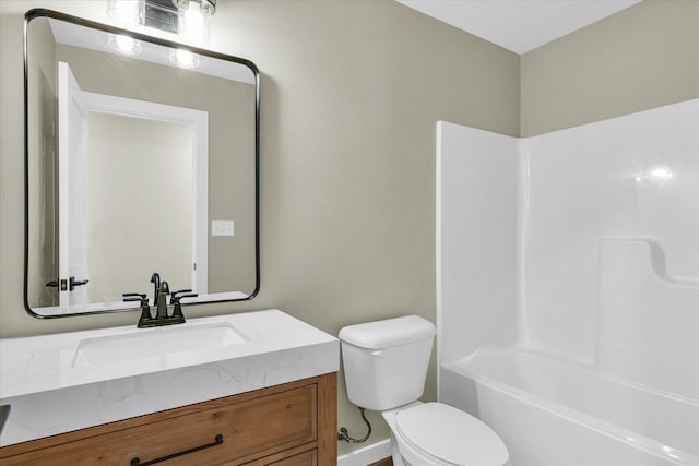 full bathroom featuring vanity,  shower combination, and toilet