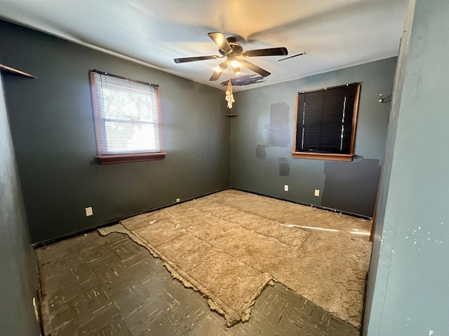 spare room featuring ceiling fan