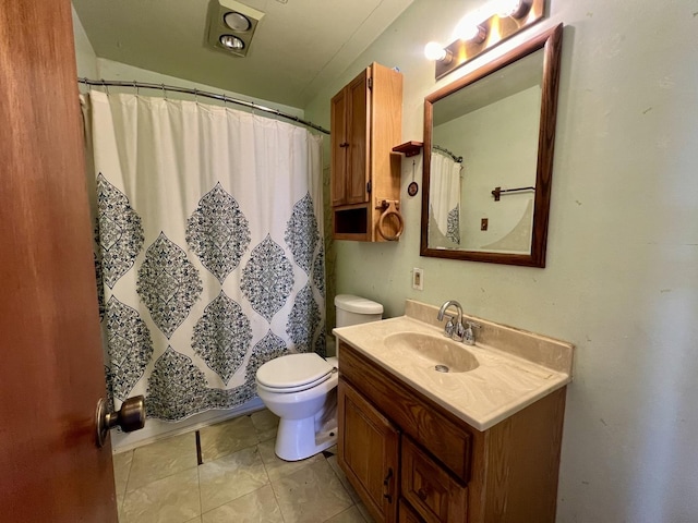 bathroom with tile patterned floors, vanity, toilet, and a shower with curtain