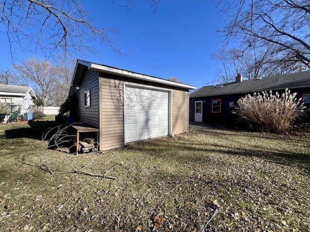 exterior space with an outdoor structure and a garage