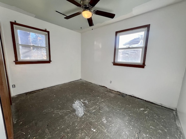 unfurnished room featuring ceiling fan