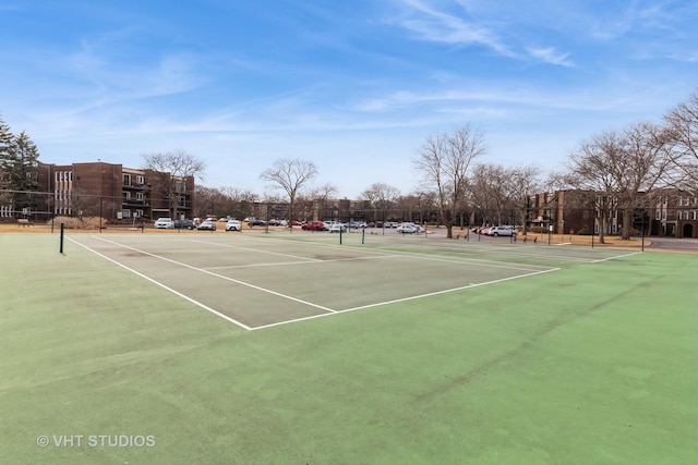 view of sport court with fence