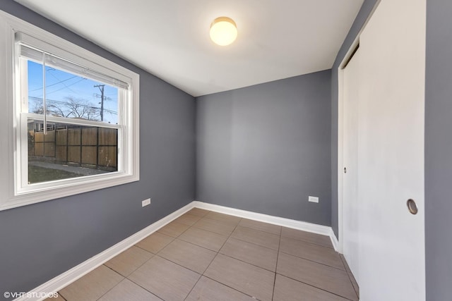 spare room featuring tile patterned flooring