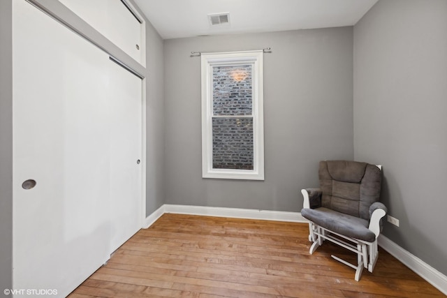 sitting room with light hardwood / wood-style floors