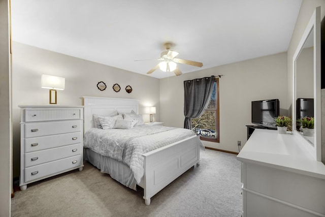 bedroom with ceiling fan and light colored carpet