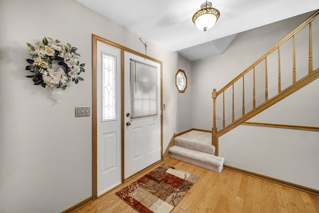 entryway with hardwood / wood-style flooring