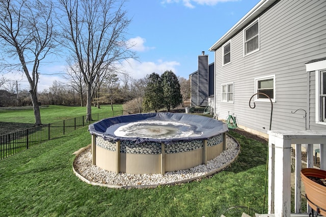 view of yard with a covered pool