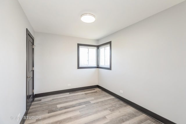 spare room with light wood-type flooring